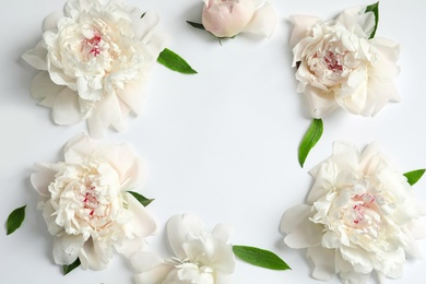Photo of Flat lay composition with beautiful blooming peonies on white background