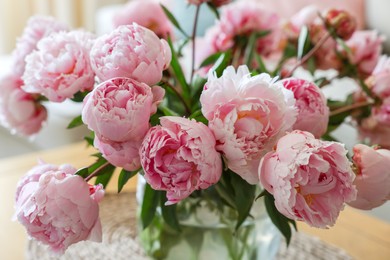 Photo of Beautiful pink peonies at home, closeup. Interior design