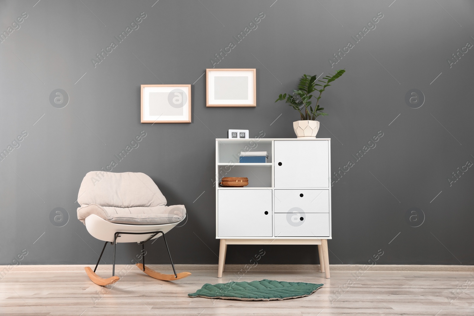 Photo of Chest of drawers in stylish living room interior