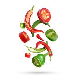 Different aromatic spices falling on white background