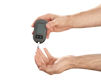 Photo of Man checking blood sugar level with glucometer on white background. Diabetes test