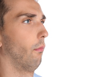 Young man with double chin on white background