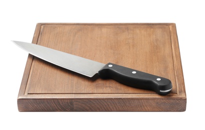 Photo of Chef's knife and wooden board isolated on white