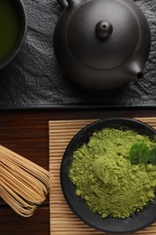 Photo of Flat lay composition with green matcha powder on wooden table