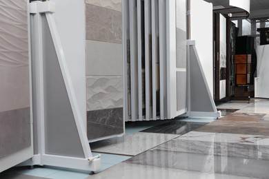 Photo of Assortment of tiles in store. Many different samples indoors