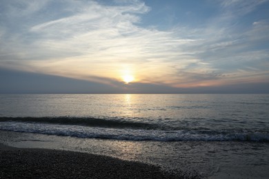 Photo of Picturesque view of sea and tropical beach at sunset