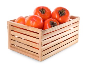Photo of Delicious ripe juicy persimmons in wooden crate isolated on white