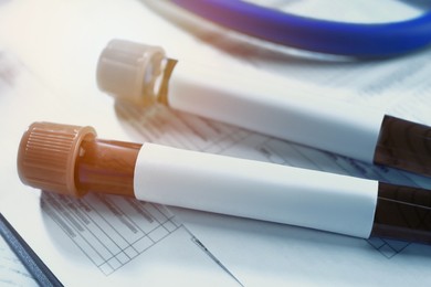 Image of Test tubes with blood samples on medical form
