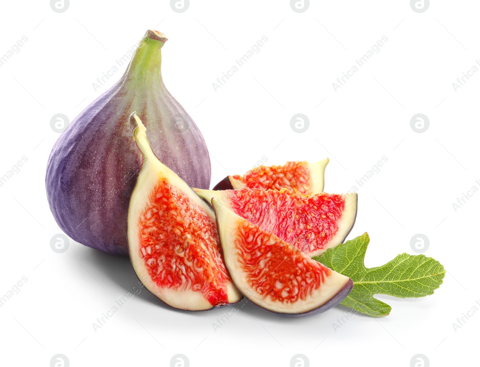 Photo of Whole and cut purple figs on white background