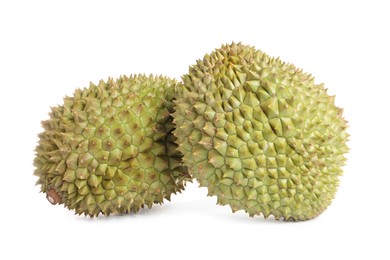 Photo of Whole ripe durian fruits on white background