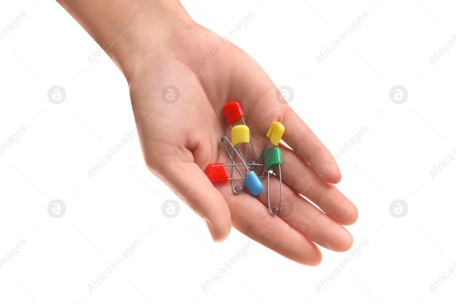 Photo of Woman holding colorful safety pins on white background, closeup