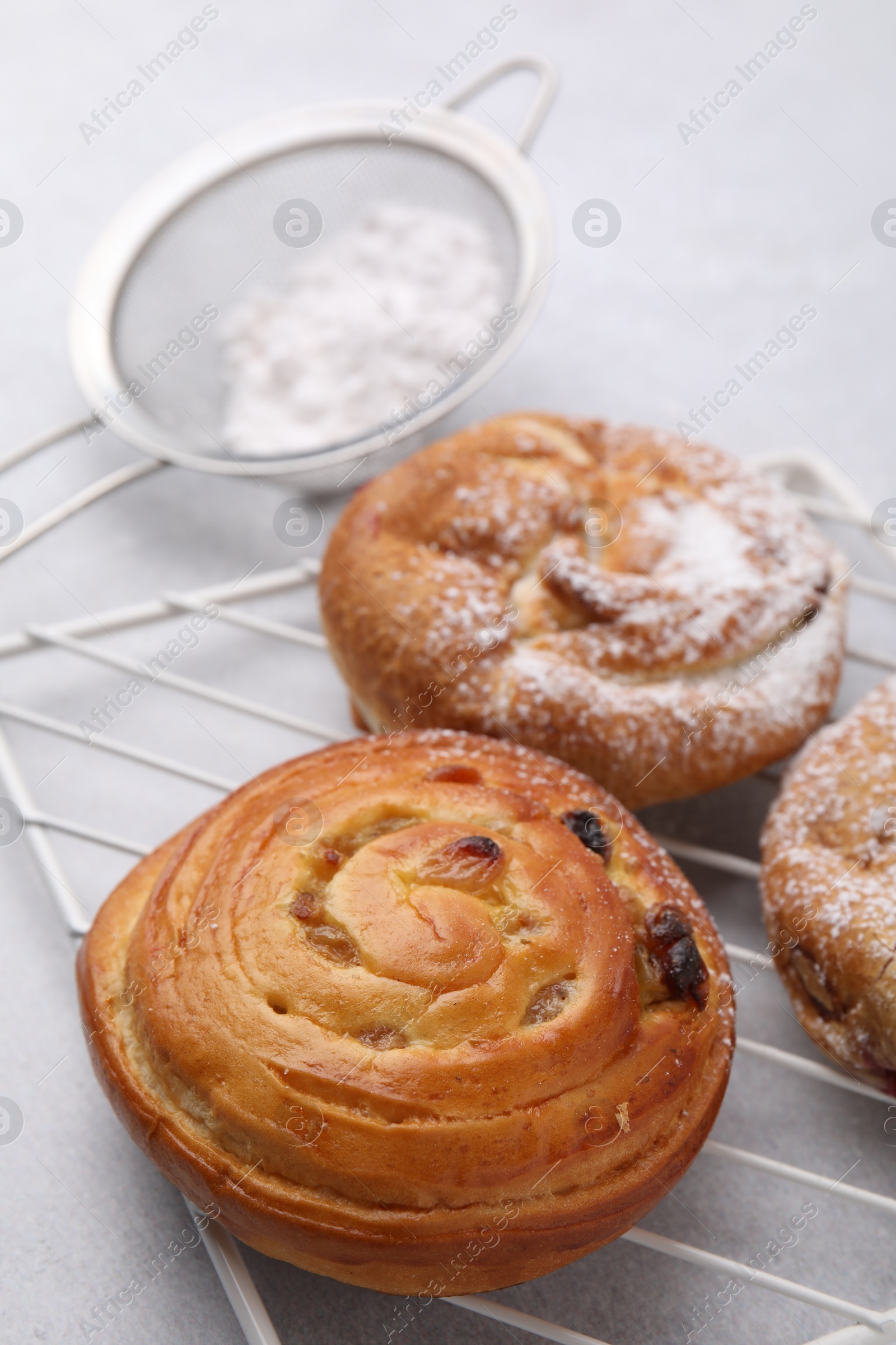 Photo of Different delicious rolls on light table. Sweet buns