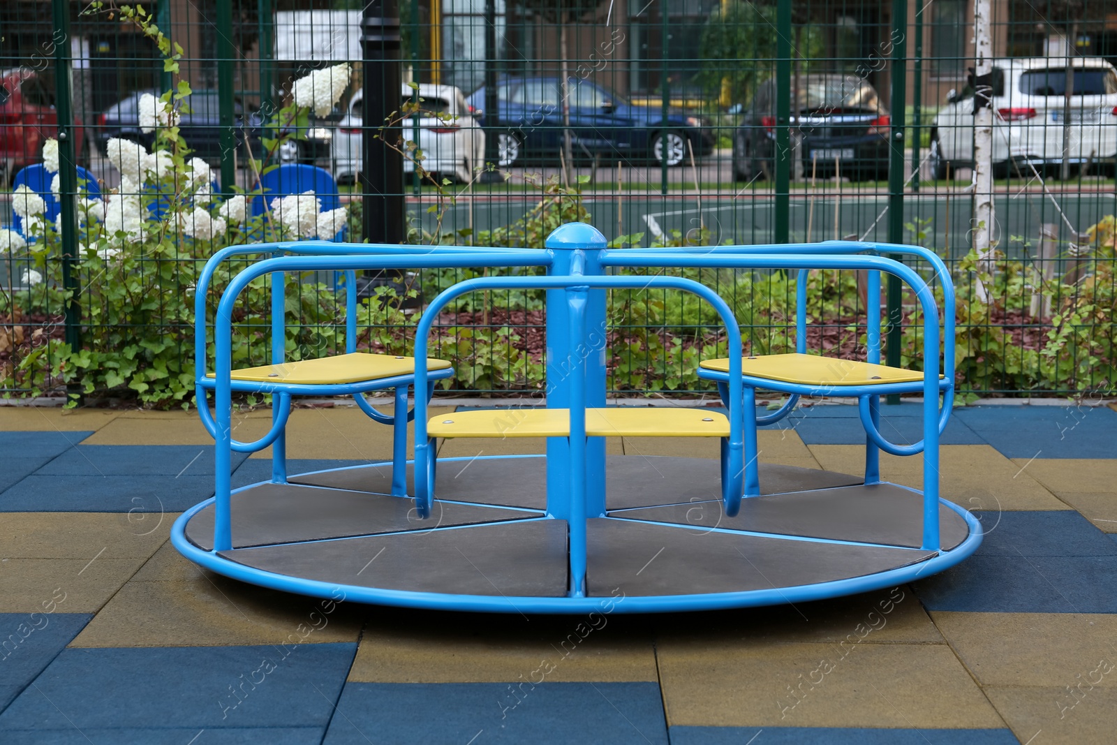 Photo of Colourful carousel for children on outdoor playground