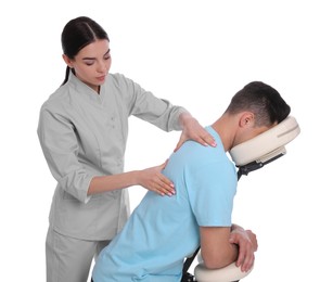 Photo of Man receiving massage in modern chair on white background