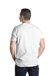 Photo of Young man in t-shirt on white background. Mockup for design