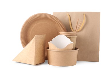 Photo of Eco friendly food packagings, disposable plate, paper bag and straws isolated on white