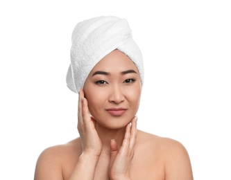 Portrait of beautiful Asian woman with towel on head against white background. Spa treatment