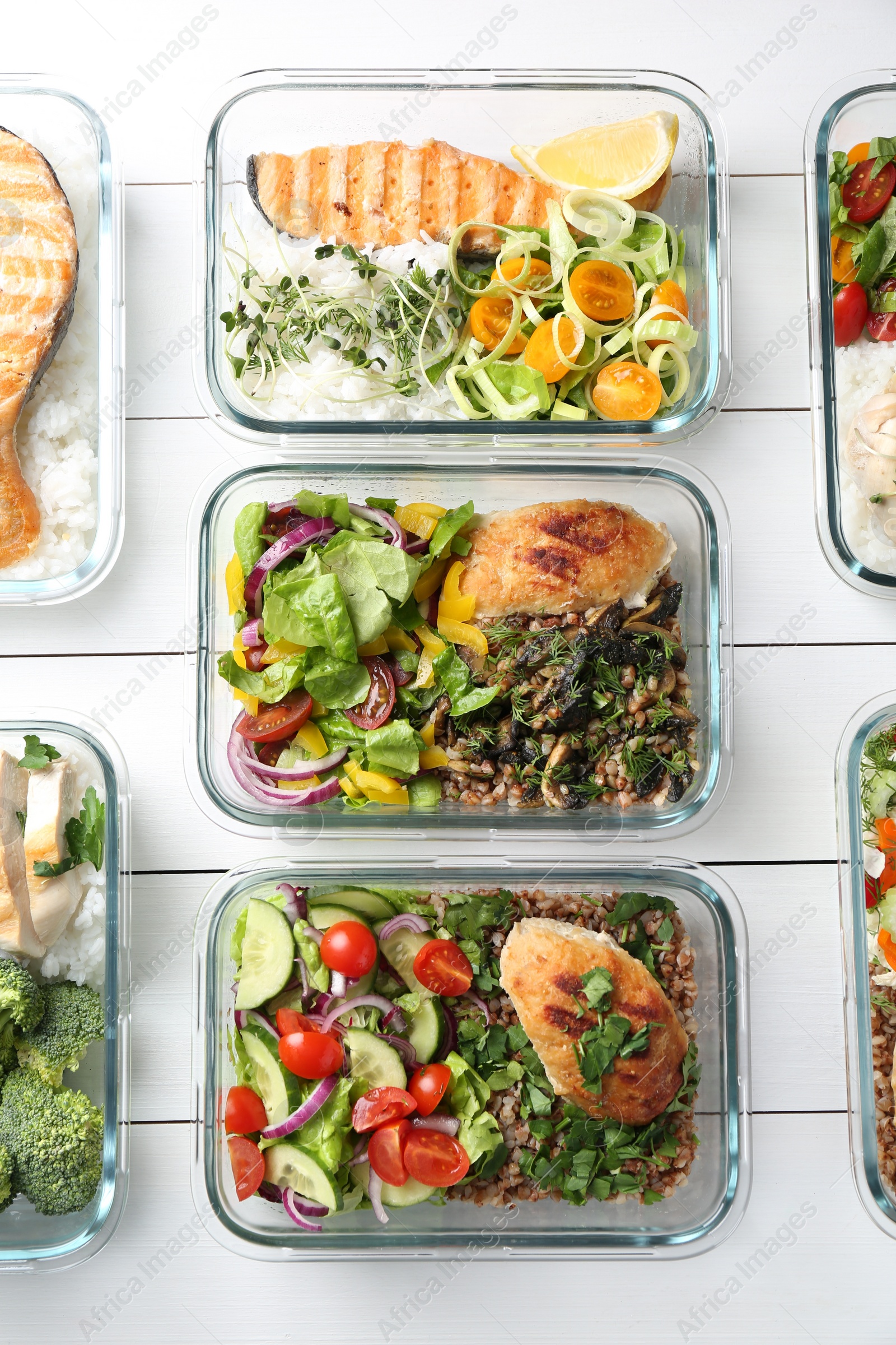 Photo of Healthy meal. Containers with different products on white wooden table, flat lay