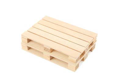 Photo of Two small wooden pallets stacked on white background