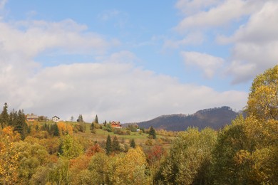 Photo of Beautiful forest and mountain village on autumn day