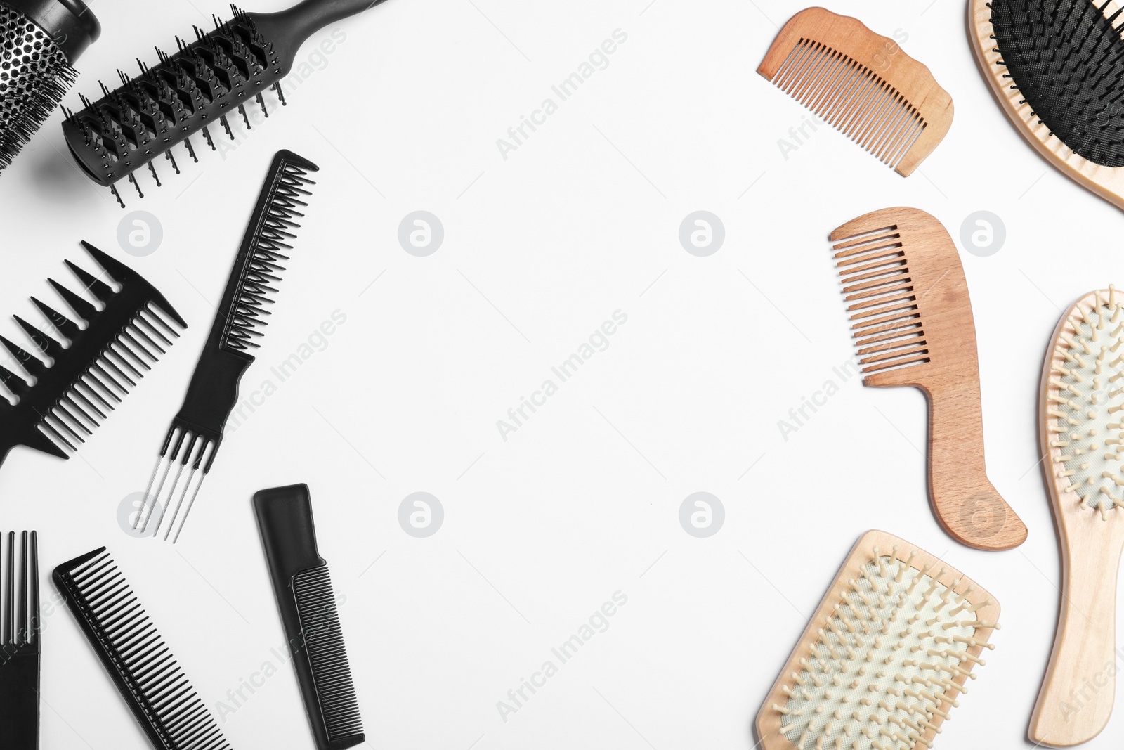 Photo of Plastic and wooden hairbrushes on white background, top view. Recycling concept