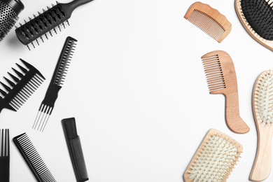 Photo of Plastic and wooden hairbrushes on white background, top view. Recycling concept