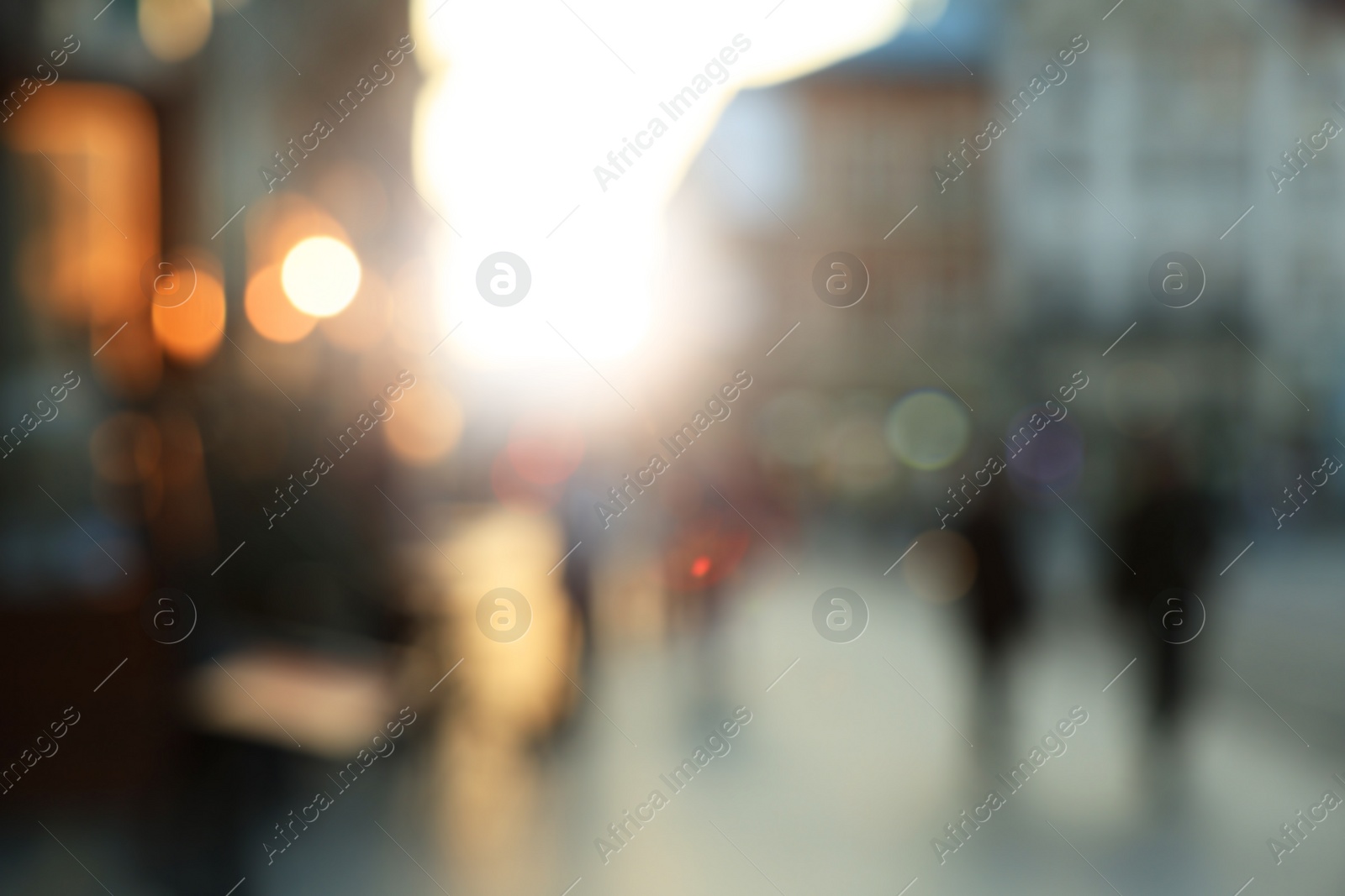 Photo of Blurred view of people walking on city street