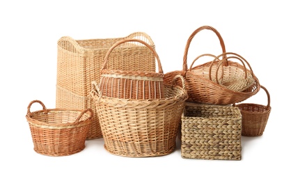 Photo of Many different wicker baskets isolated on white