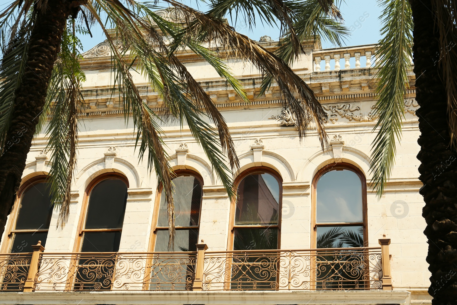 Photo of Exterior of building with windows and balcony