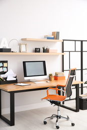 Modern computer on table in office interior. Stylish workplace