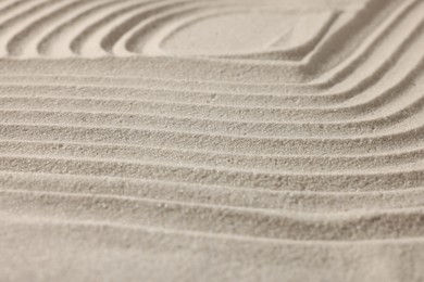 Beautiful lines drawn on sand, closeup. Zen garden