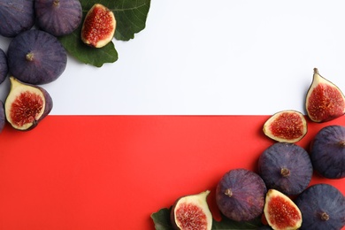 Delicious ripe figs on color background, flat lay. Space for text