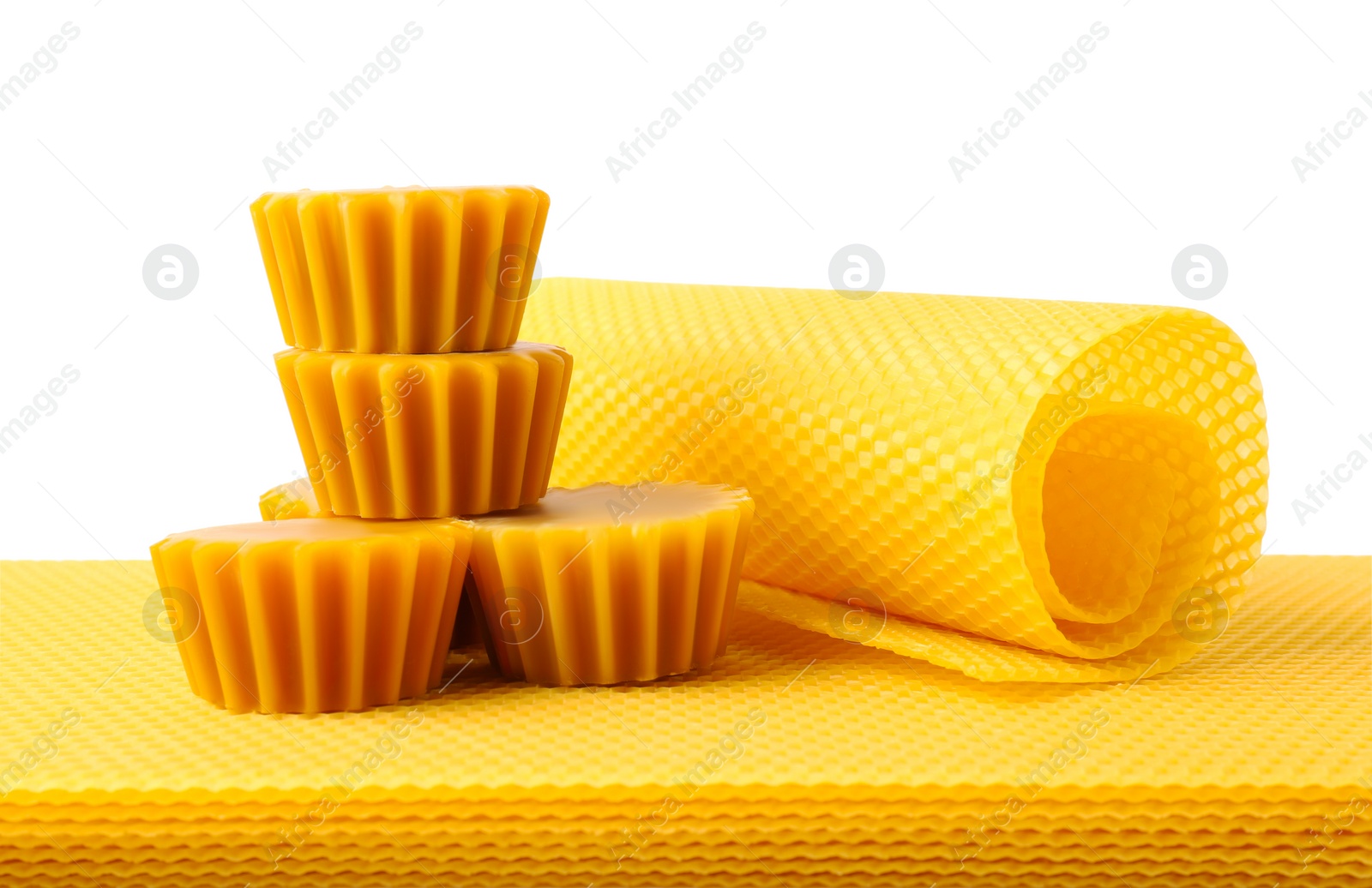 Photo of Natural beeswax cake blocks and sheets on white background