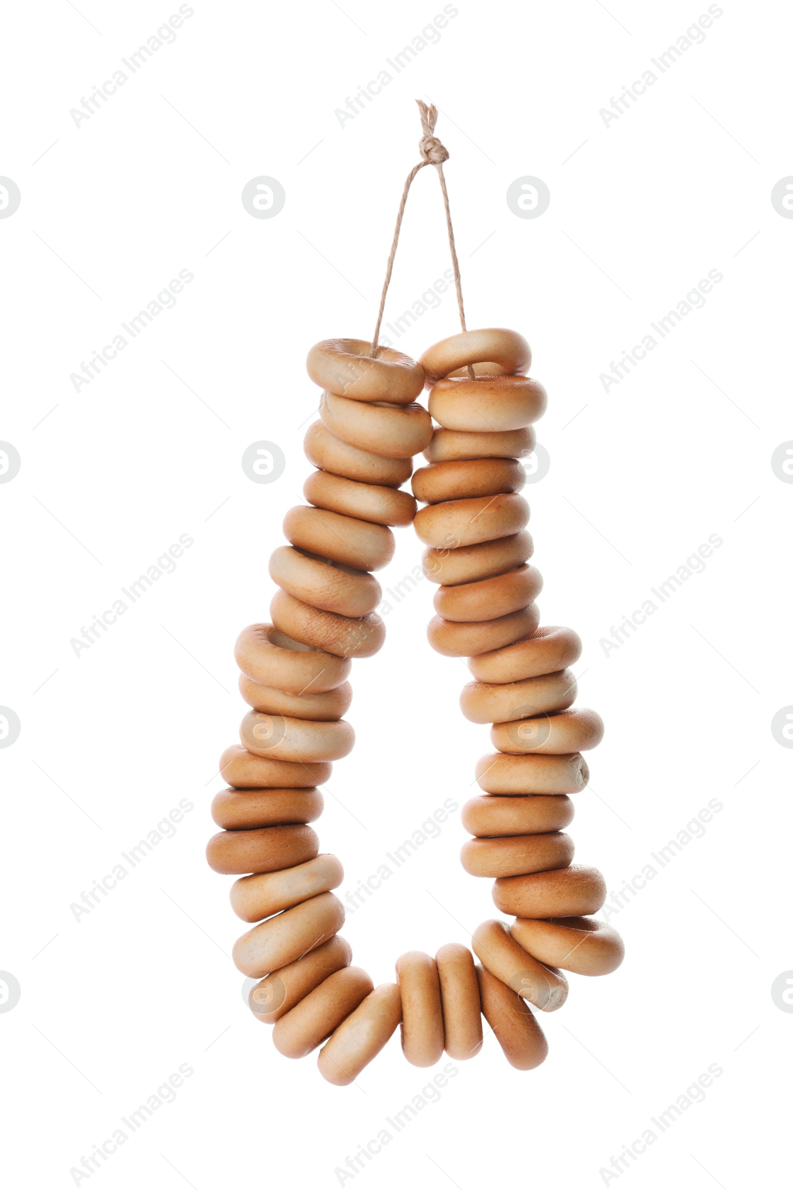 Photo of Bunch of delicious ring shaped Sushki (dry bagels) on white background