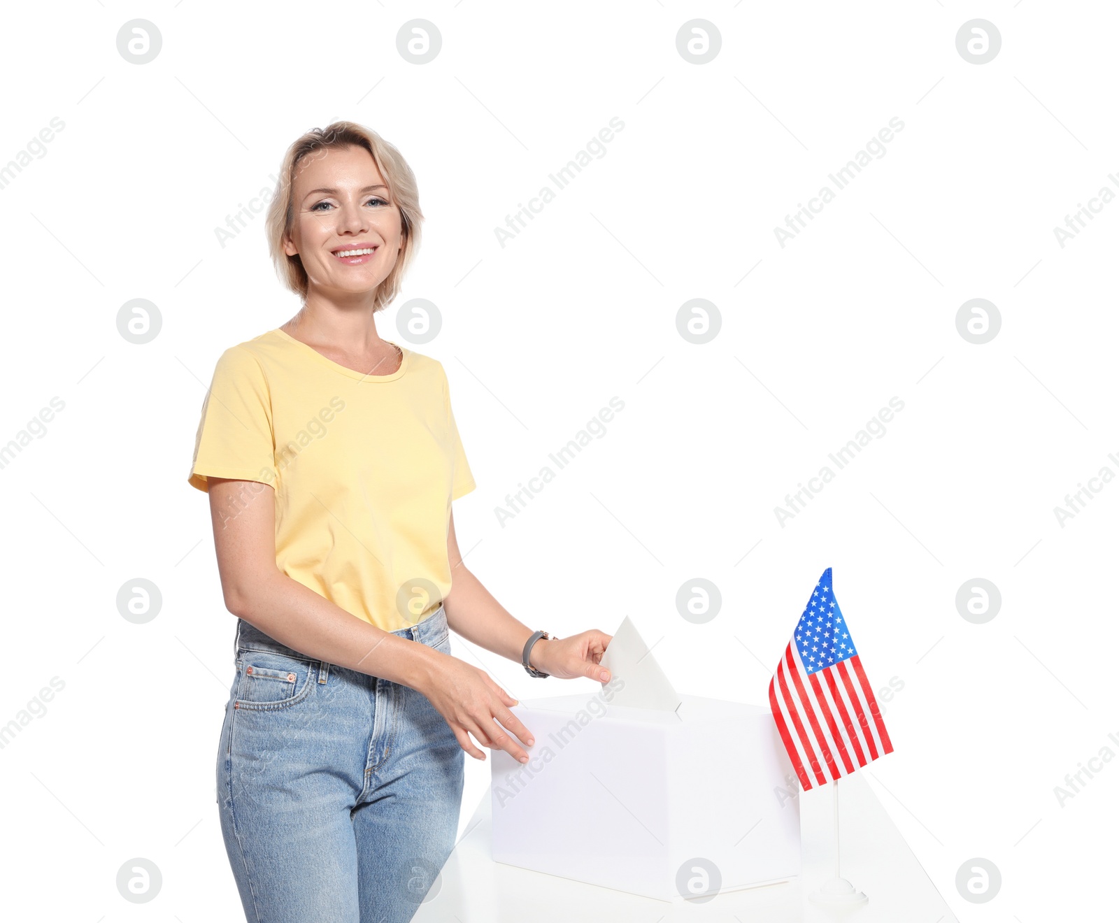 Photo of Woman putting ballot paper into box against white background