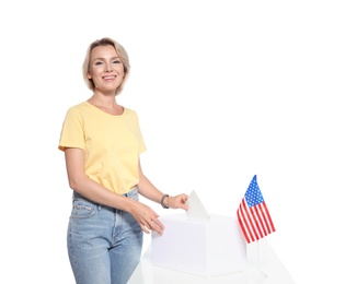 Photo of Woman putting ballot paper into box against white background