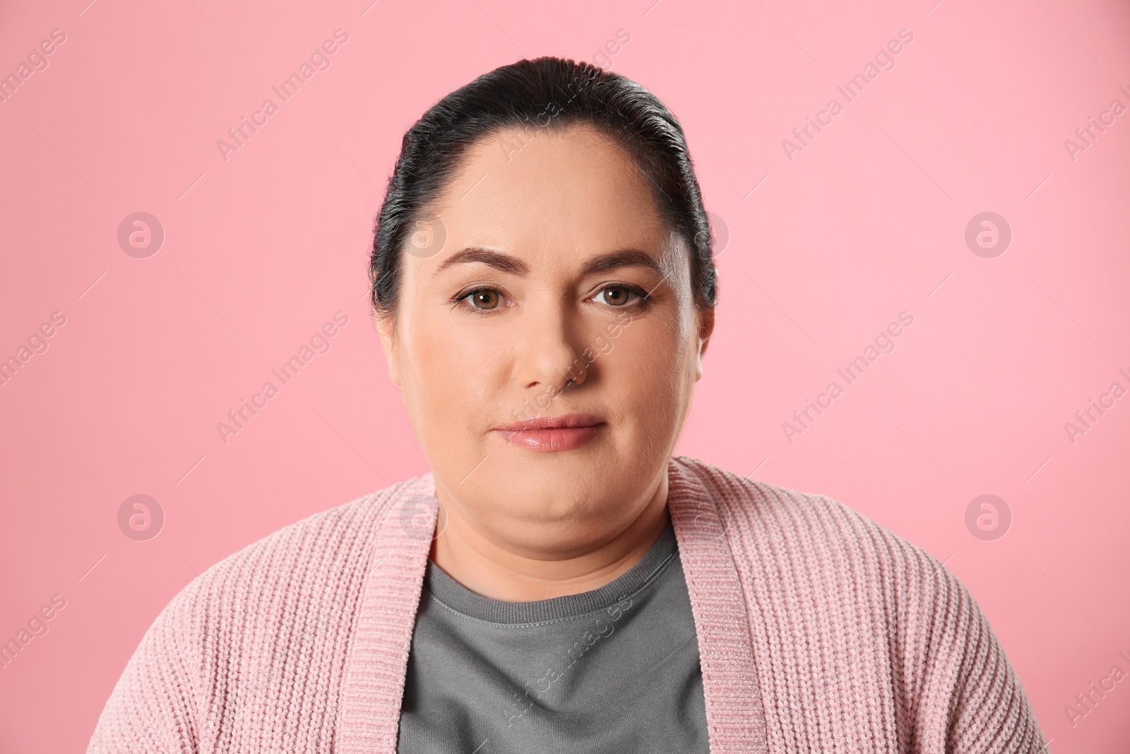 Photo of Woman with double chin on pink background