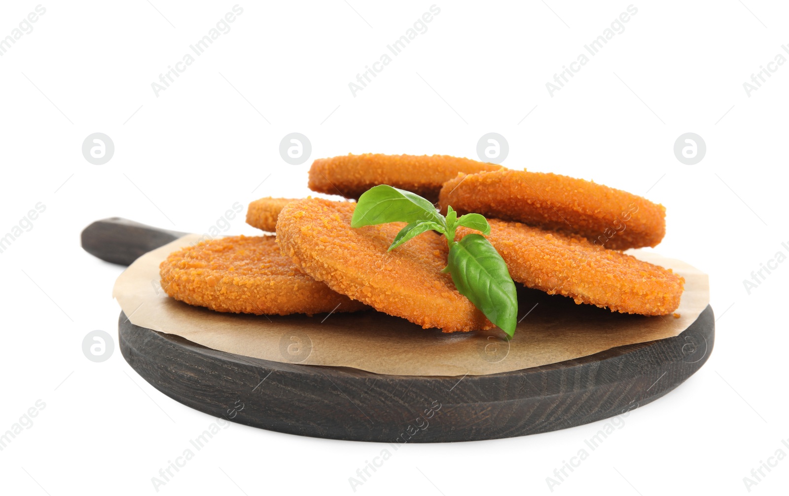 Photo of Delicious fried breaded cutlets with basil leaves isolated on white