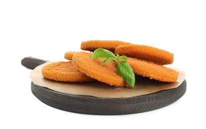 Delicious fried breaded cutlets with basil leaves isolated on white