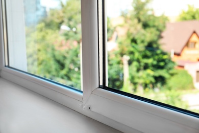 Photo of Modern window in room, closeup view. Home interior