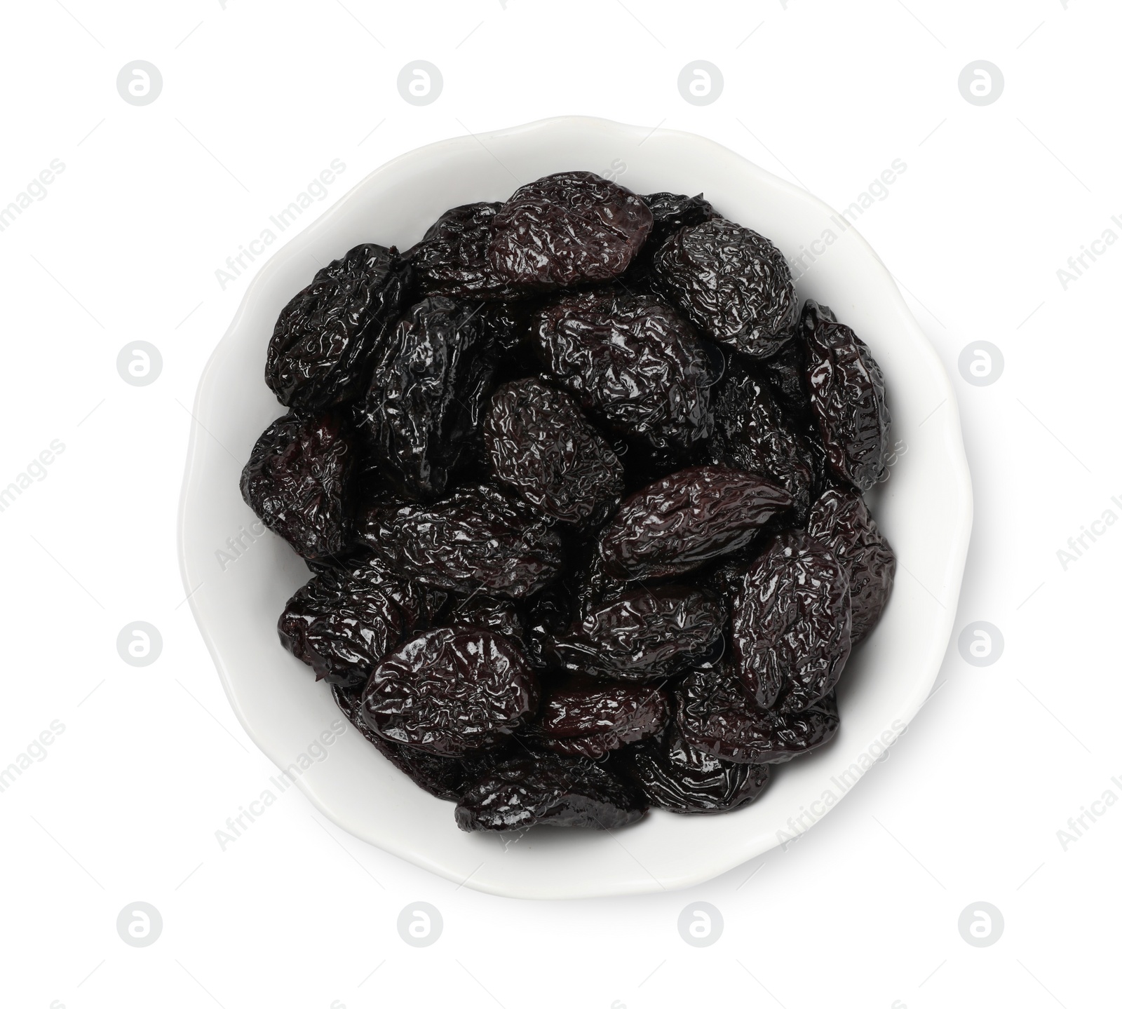 Photo of Bowl with sweet dried prunes isolated on white, top view