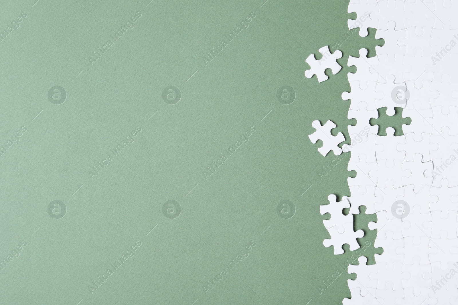 Photo of Blank white puzzle on grey background, flat lay. Space for text