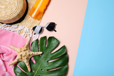 Photo of Flat lay composition with beach objects on color background. Space for text