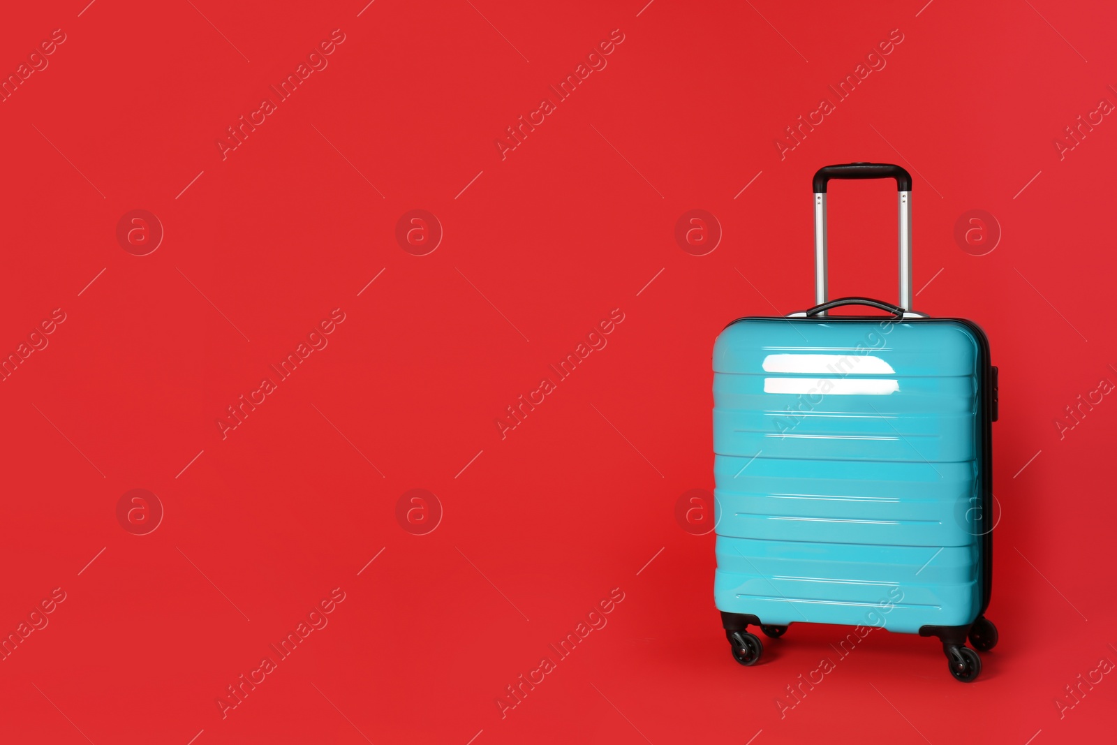 Photo of Stylish suitcase on color background. Space for text