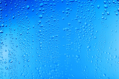 Photo of View of glass with water drops, closeup