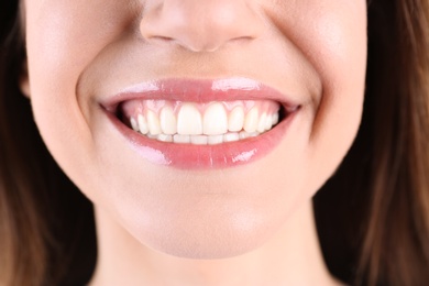 Photo of Young smiling woman with healthy teeth, closeup