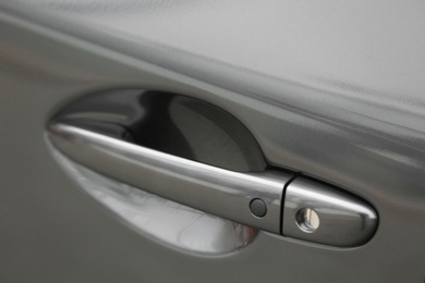 Photo of Closeup view of car door with handle