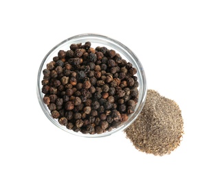 Photo of Ground black pepper and corns isolated on white, top view