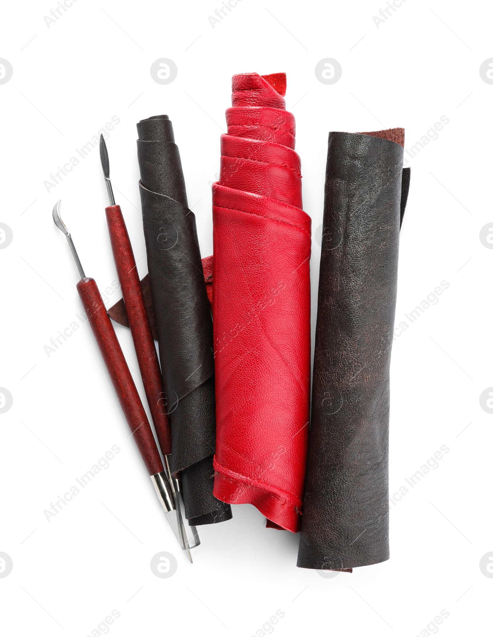 Photo of Leather samples and craftsman tools isolated on white, top view