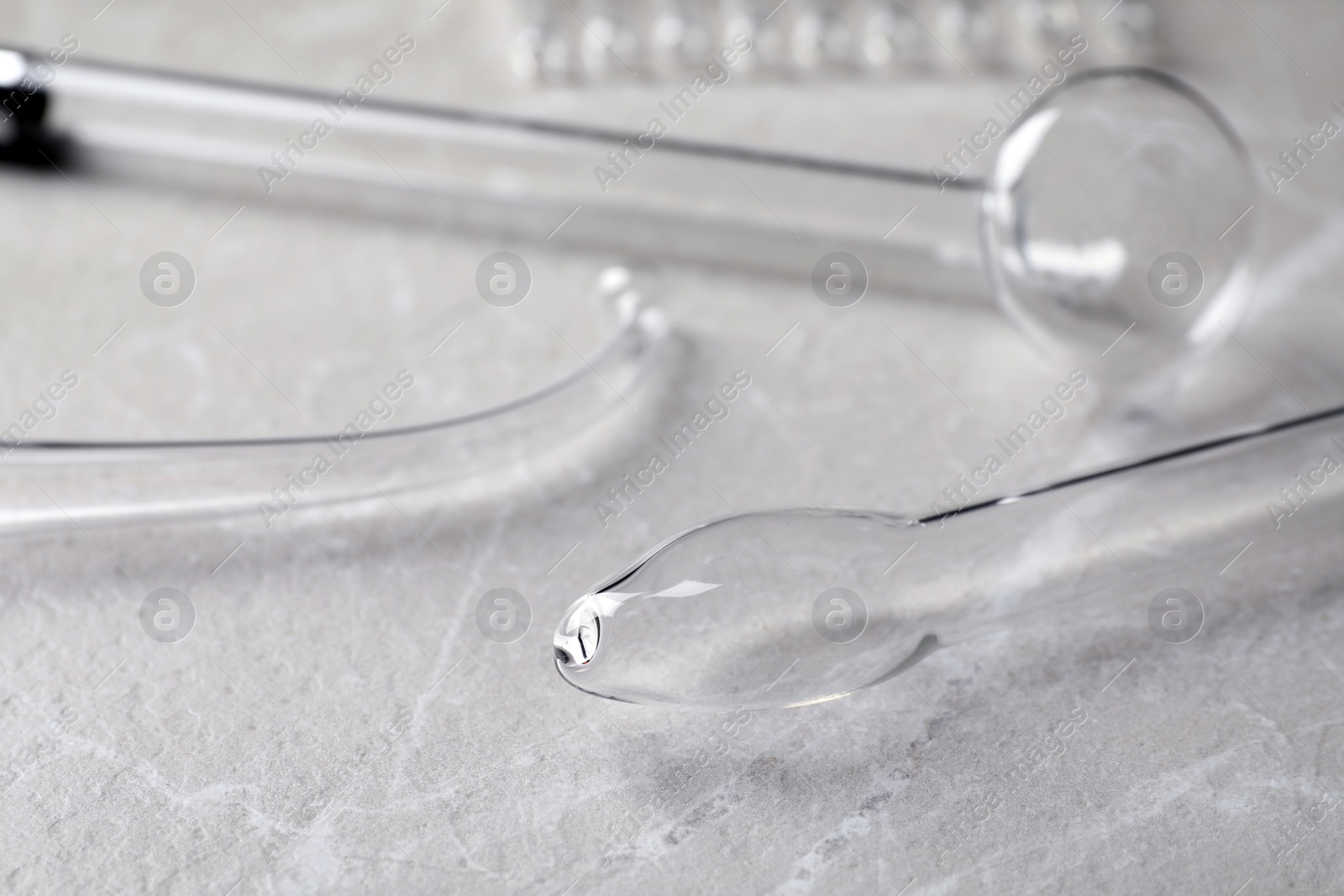 Photo of Different darsonval nozzles on grey table, closeup